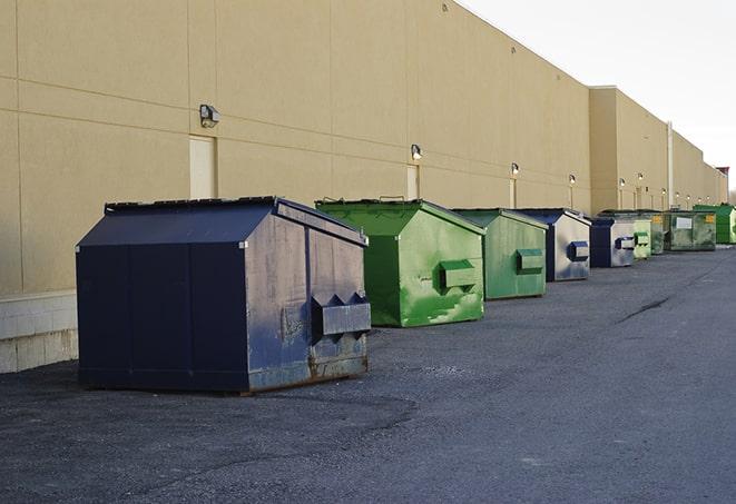 red and green waste bins at a building project in Calhoun Falls